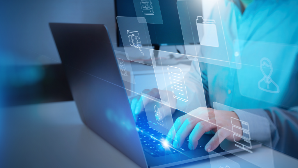 An image of a person typing on a laptop keyboard.