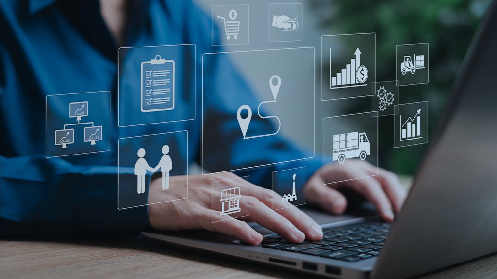 An image of a person typing on a laptop keyboard. Various transparent symbols related to ecommerce and logistics are superimposed.