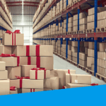 An image showing a pile of boxes wrapped in red ribbons in the middle of a warehouse aisle.