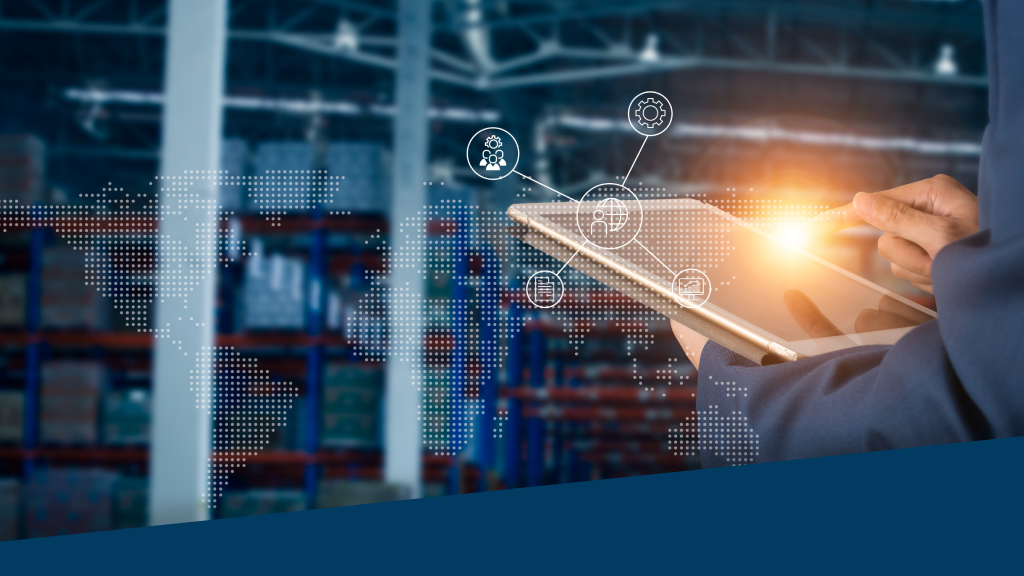 An image depicting a warehouse worker using a tablet in a warehouse.