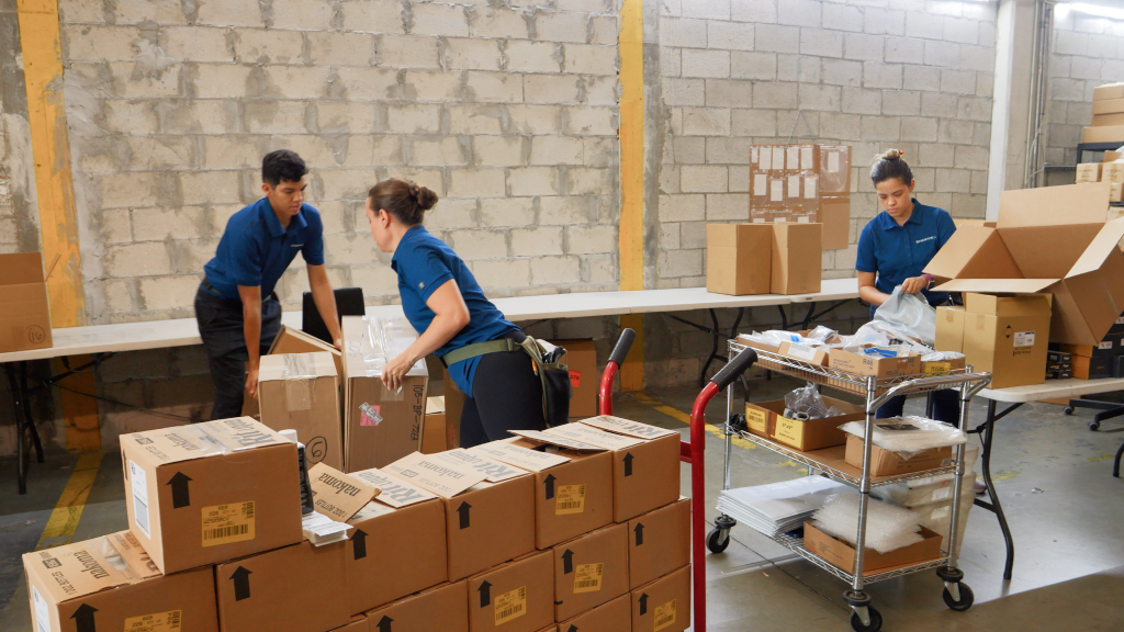 An image showing warehouse workers moving orders.