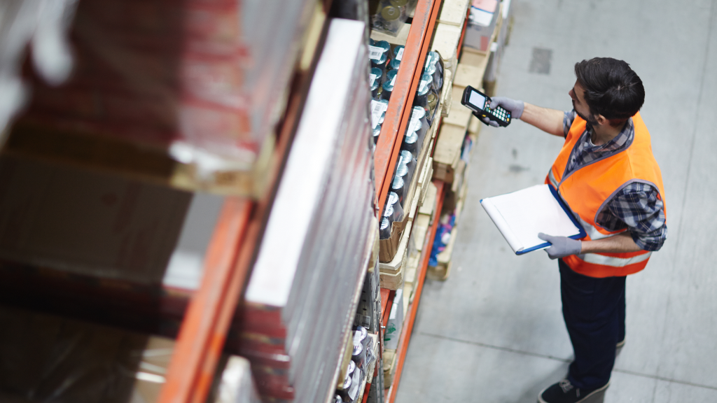An image of a warehouse worker scanning an order item.